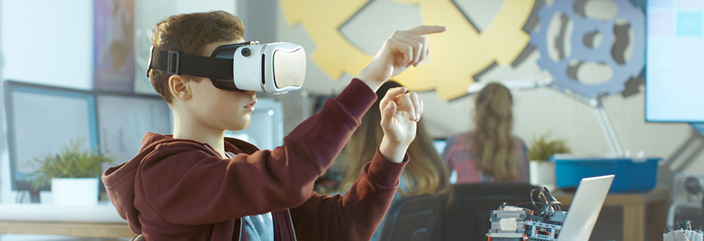 In a Computer Science Class Boy Wearing Virtual Reality Headset